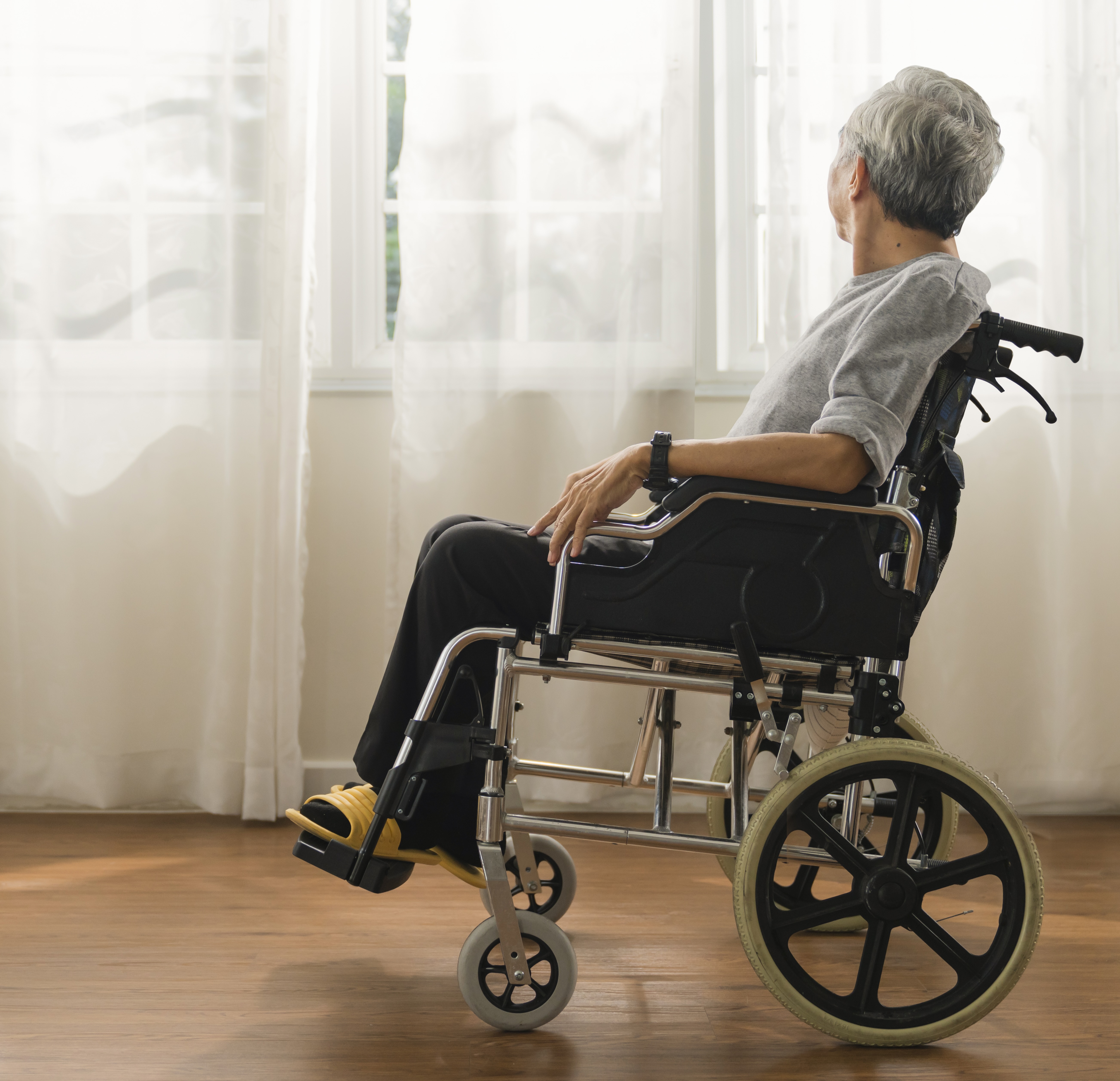 Senior woman in wheelchair at hospital